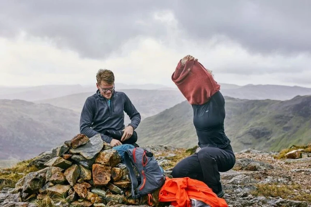 Hiking boots and socks preventing blisters on a trail