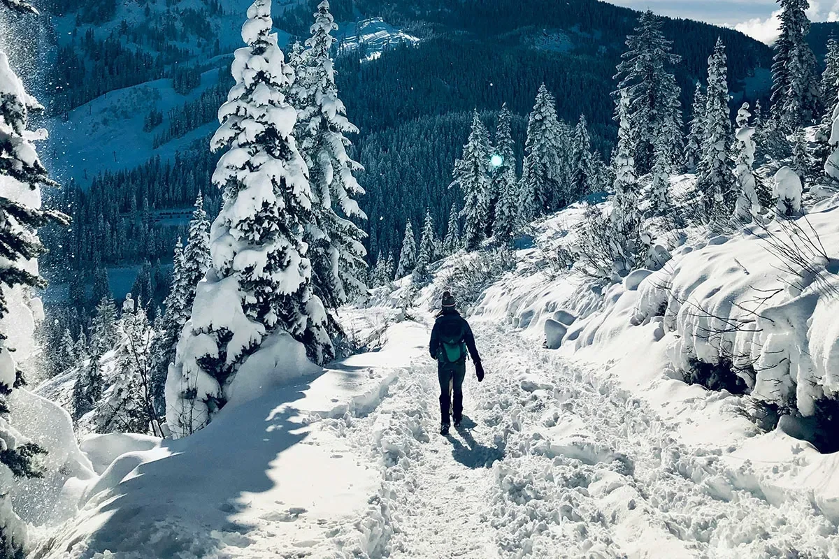 Hiking in winter with proper layering and gear for warmth