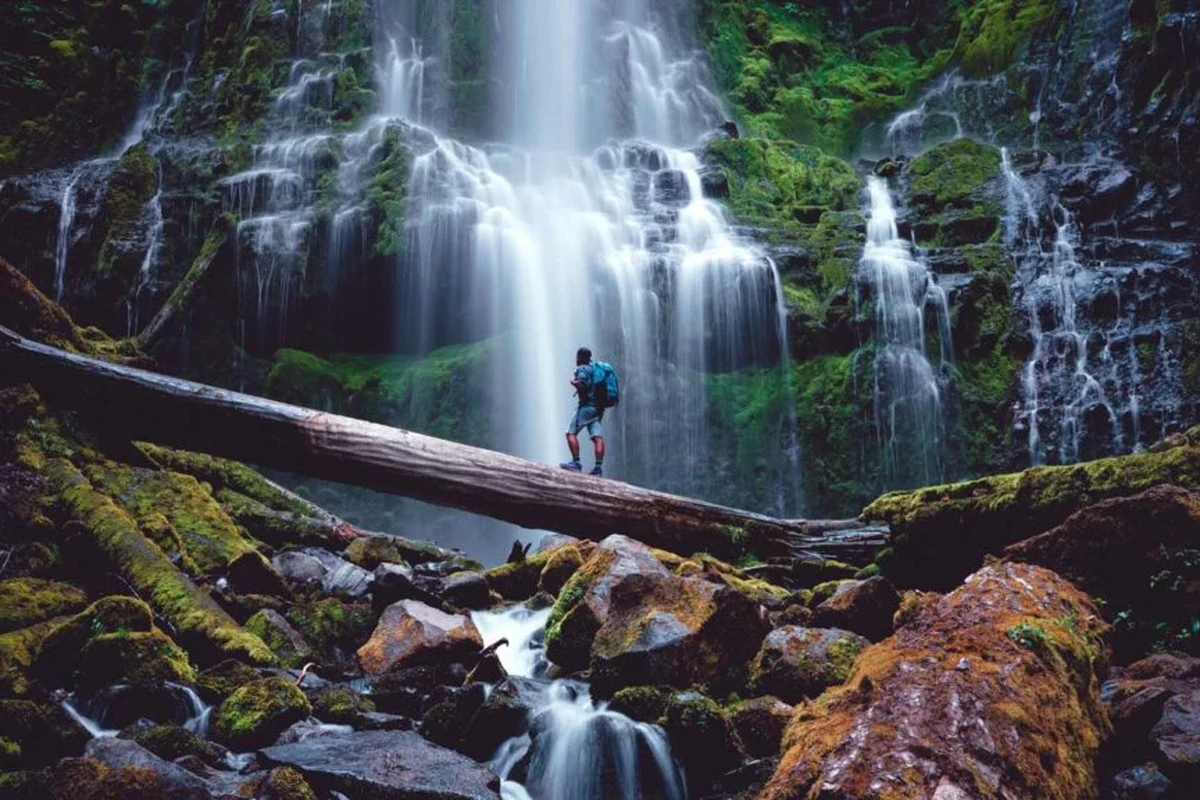 A hiker enjoying stunning views on a mountain trail.
