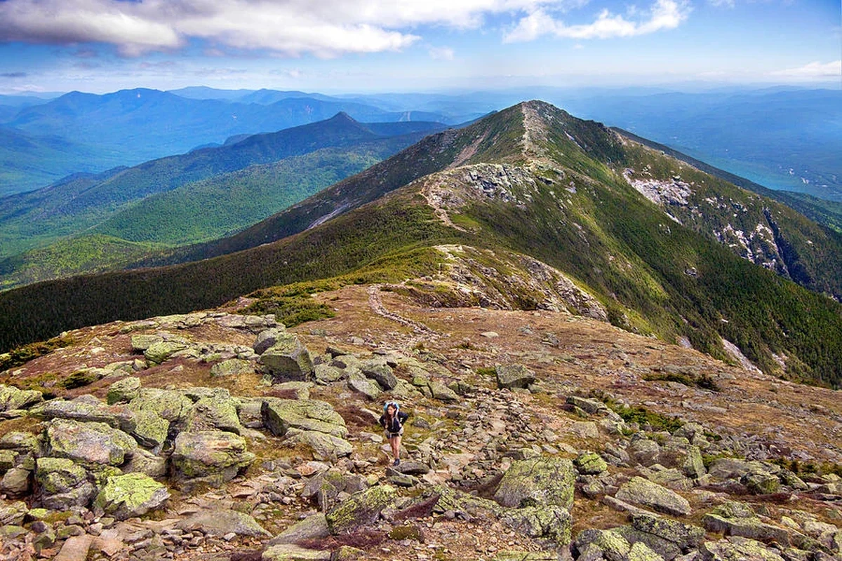 Hiker enjoying the scenic views in the White Mountains NH