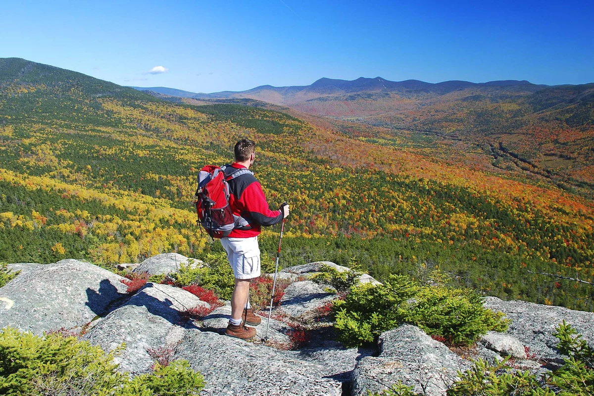 Hiker on a trail in the New Hampshire White Mountains