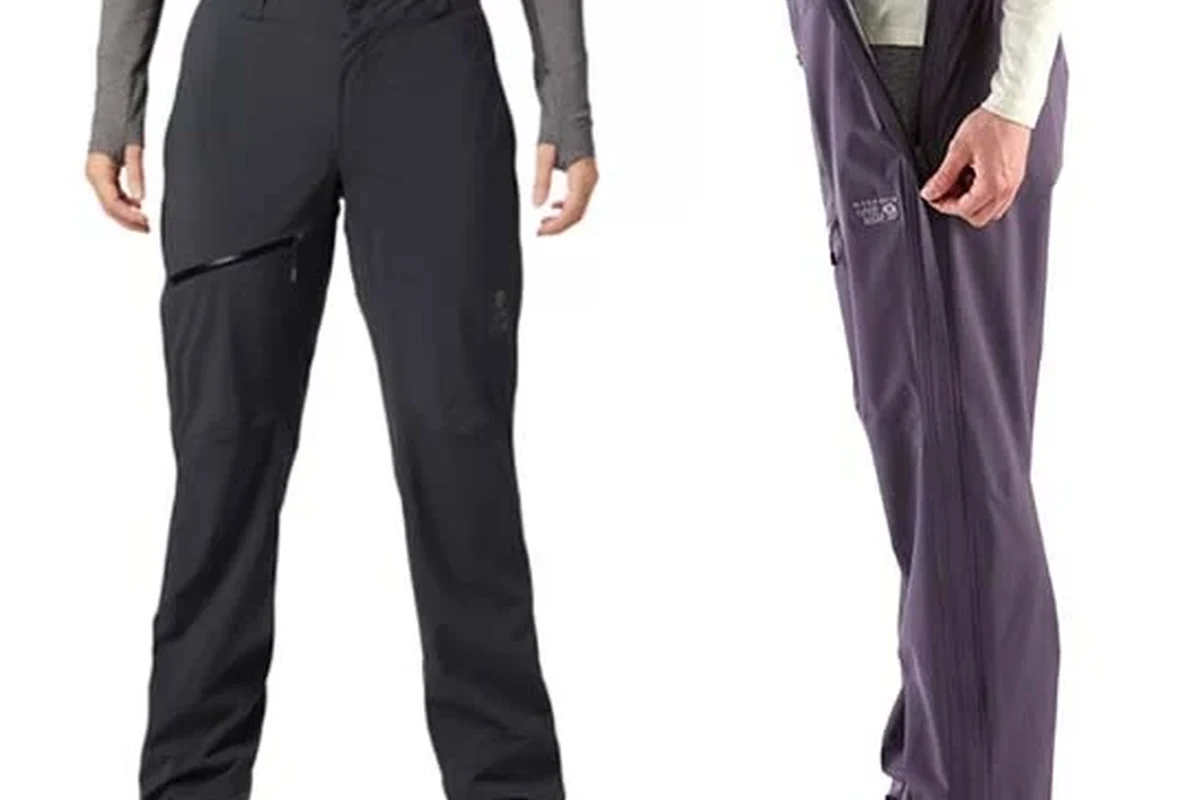 A woman hiking in lightweight waterproof pants in nature.