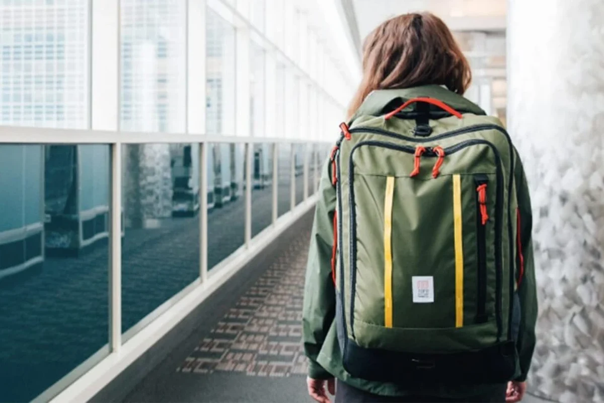 Carry on backpack for international travel in an airport setting