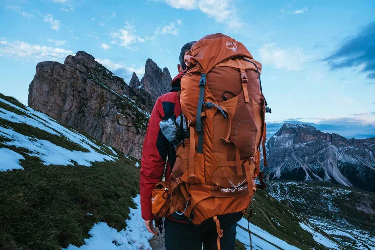 Traveler packing a comfortable travel backpack for outdoor adventures