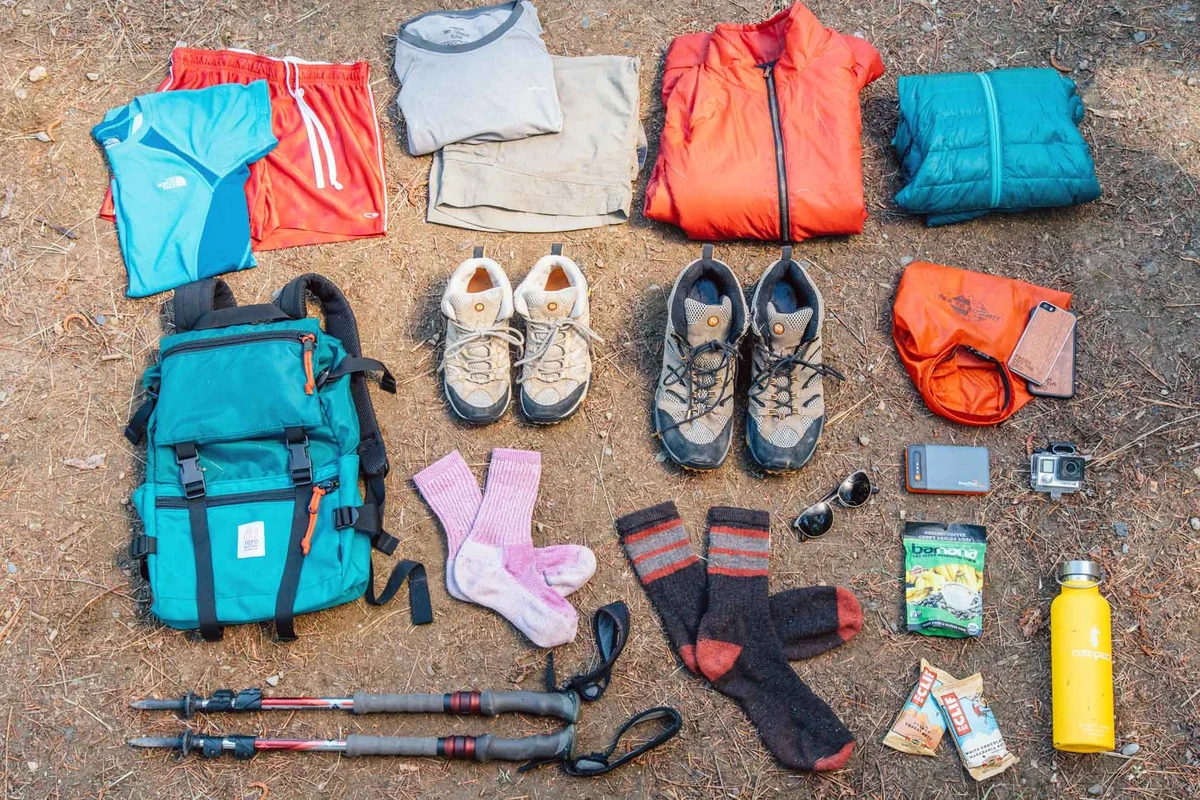 A woman hiking in lightweight waterproof pants in nature.